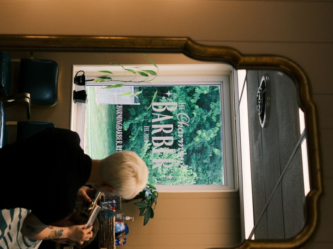 The shop window logo reflected in the mirror